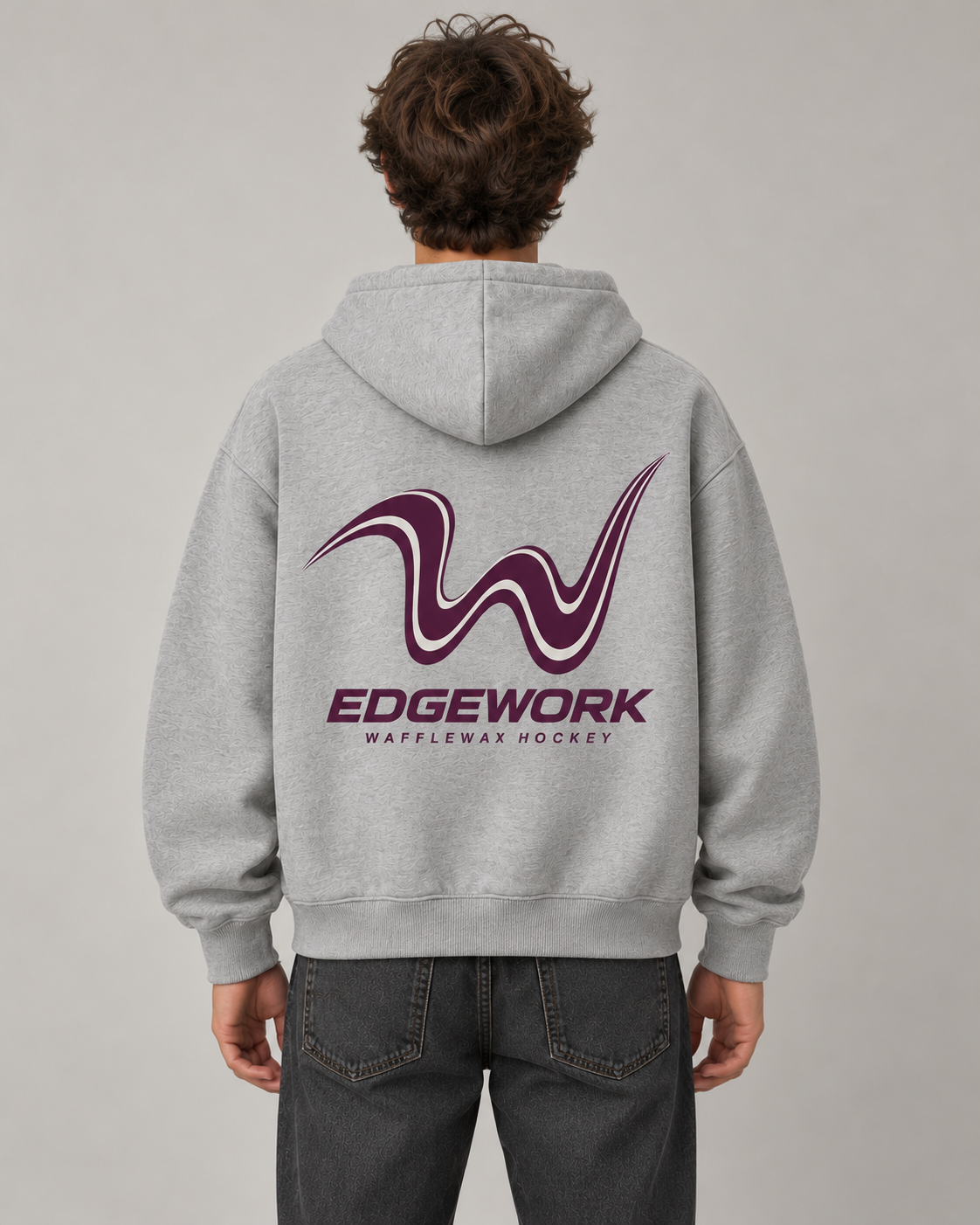 AI-generated back-view mockup of a teen model wearing the athletic grey EDGEWORK hoodie with plum-and-white curved W artwork and EDGEWORK lettering.