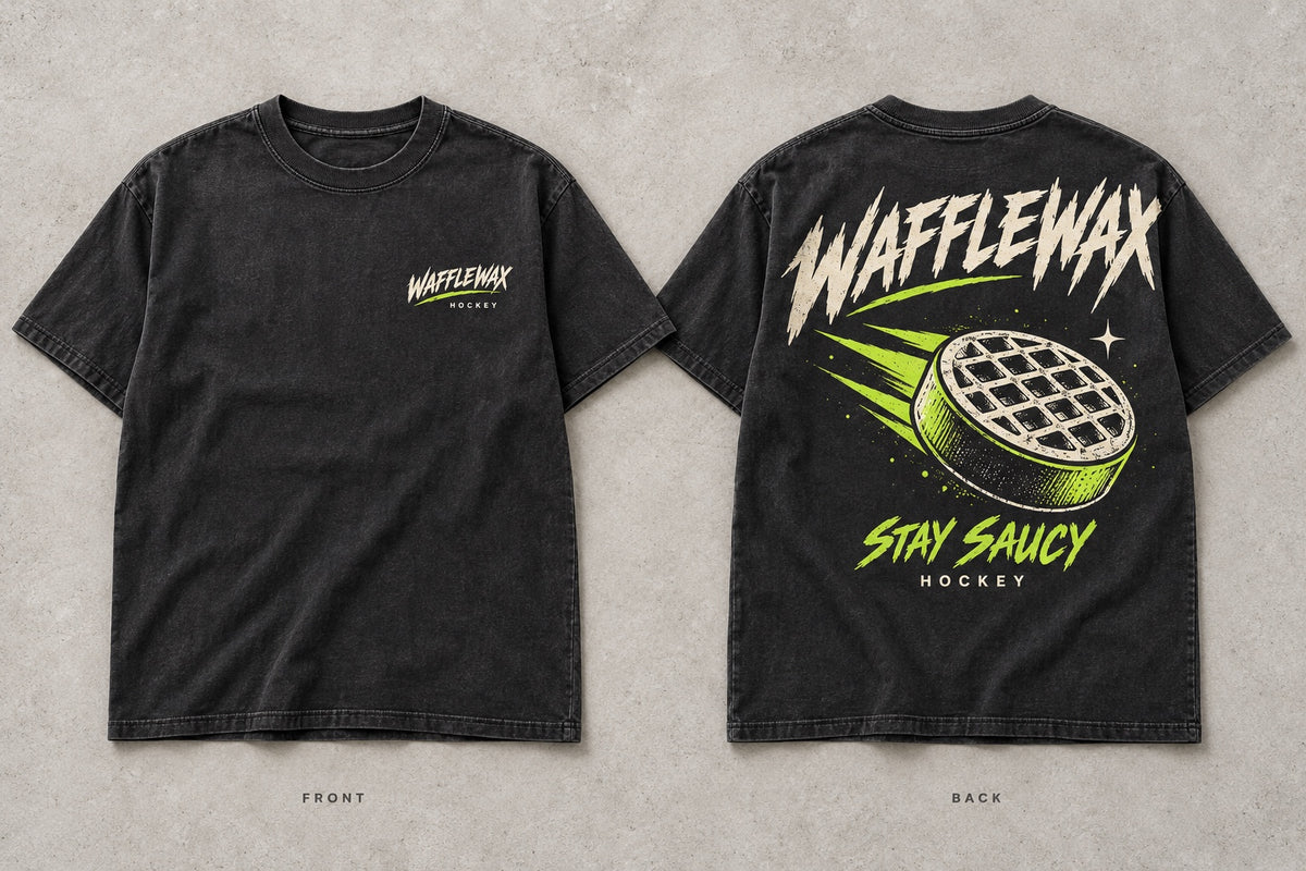 Front and back design mockup of the washed-black WaffleWax Stay Saucy Hockey Tee with cream and lime graphics.